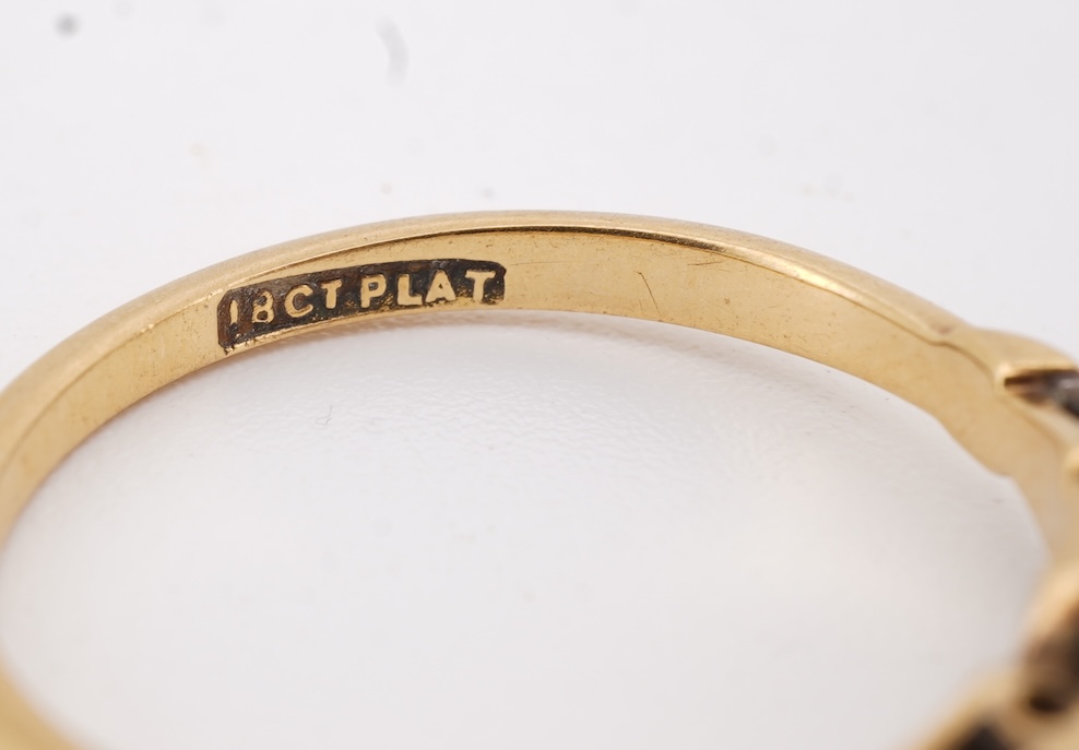 A diamond ring, set with a brilliant-cut diamond weighing approximately 0.20 carats, mounted in gold and platinum, size O1/2, stamped 18CT PLAT, gross weight approximately 2 grams, Condition: good, minor wear, diamond es